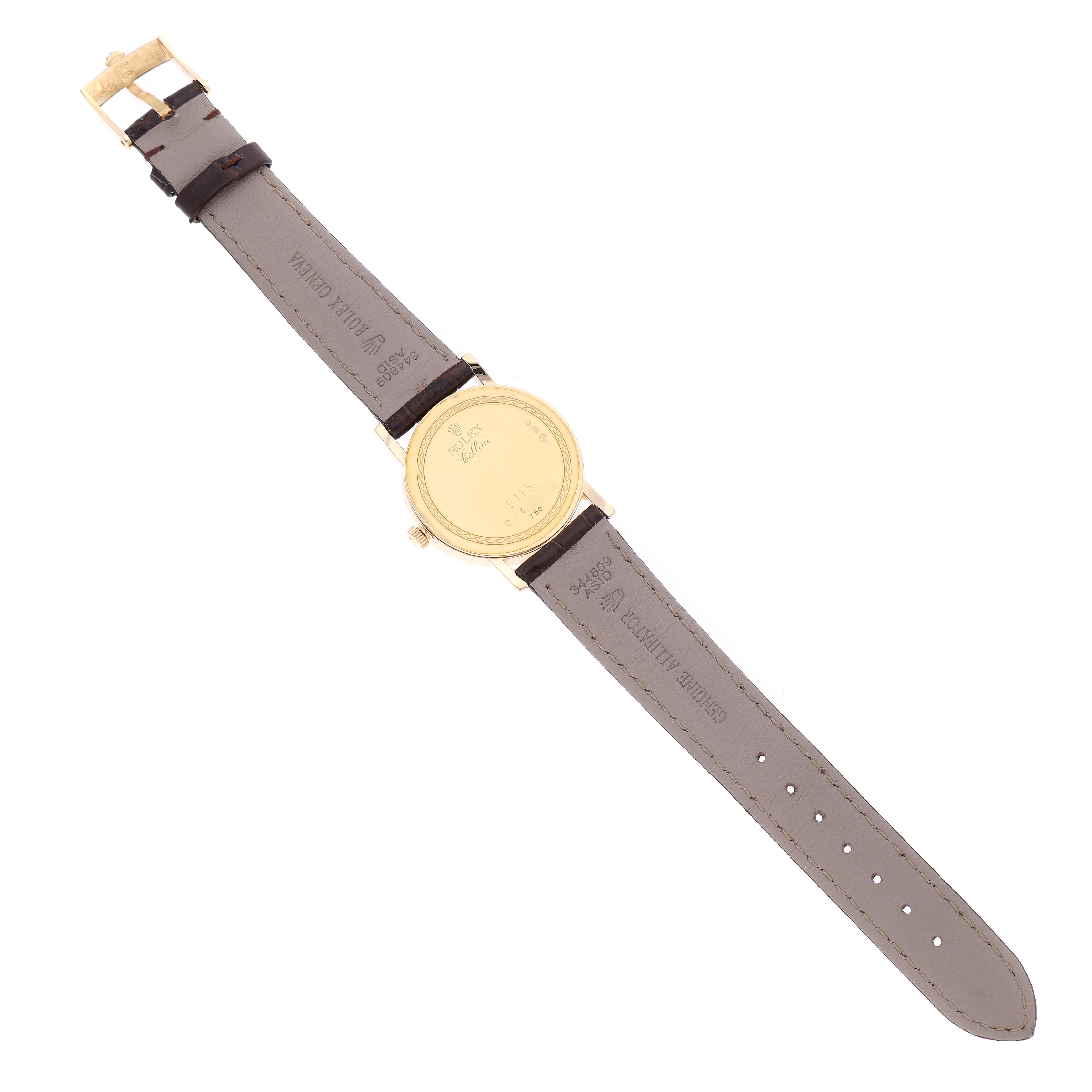 The image shows the back view of a Rolex Cellini 5115 Men
s Yellow Gold Silver Dial 5115 Men
s Yellow Gold Silver Dial watch, displaying the case back and leather strap.