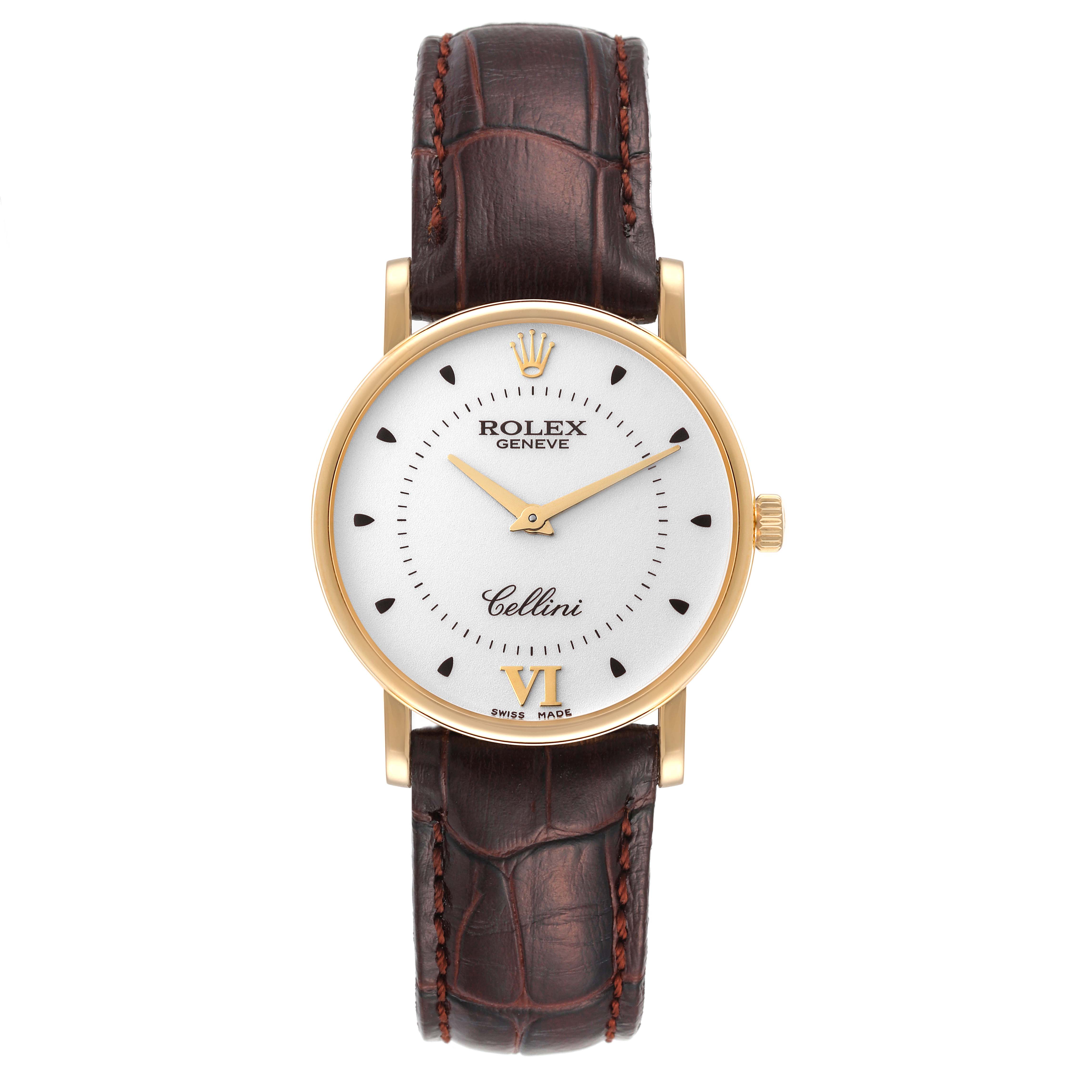 The Rolex Cellini 5115 Men
s Yellow Gold Silver Dial 5115 Men
s Yellow Gold Silver Dial watch is shown from a top-down angle, displaying its face, dial, and brown leather strap.
