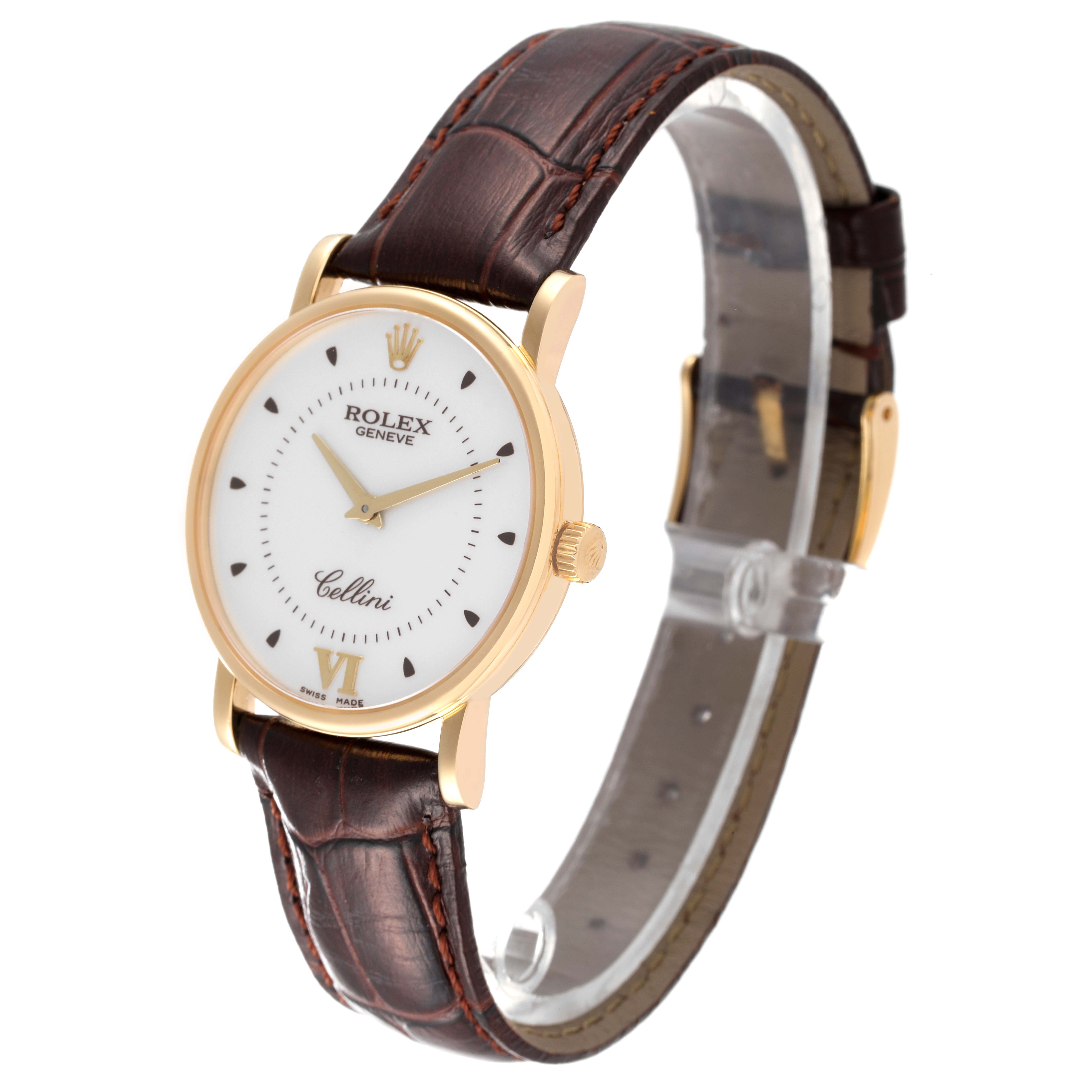 The image shows a Rolex Cellini 5115 Men
s Yellow Gold Silver Dial 5115 Men
s Yellow Gold Silver Dial watch at a slight side angle, highlighting its gold case, white dial, and brown leather strap.