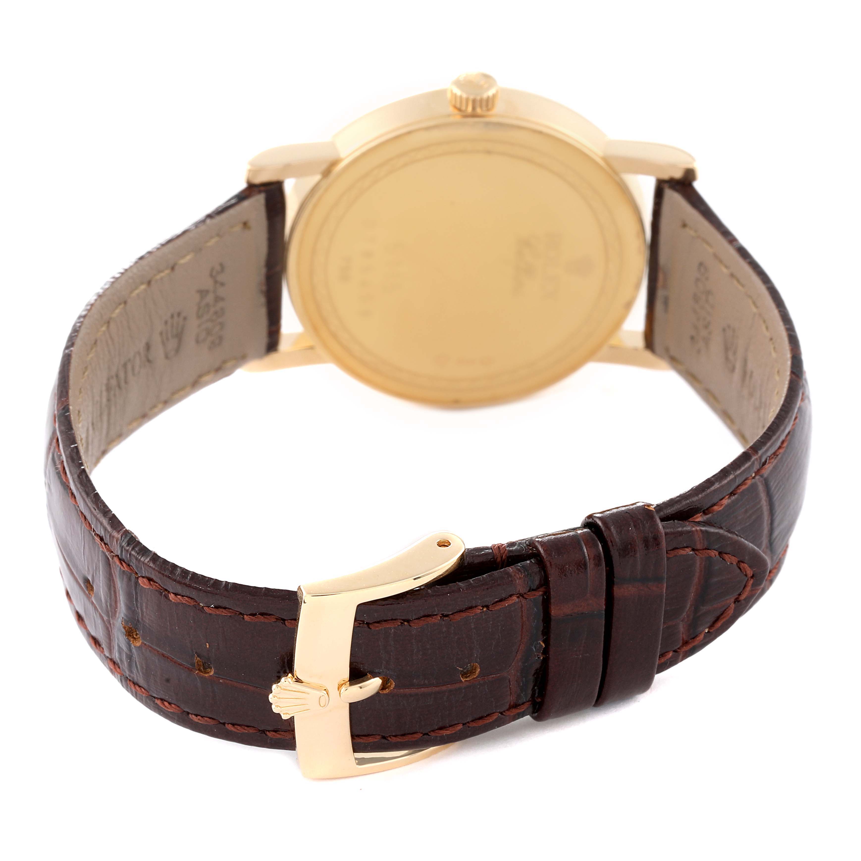 The image shows the rear view of the Rolex Cellini 5115 Men
s Yellow Gold Silver Dial 5115 Men
s Yellow Gold Silver Dial watch, highlighting the backside of the case and the leather strap with a clasp.