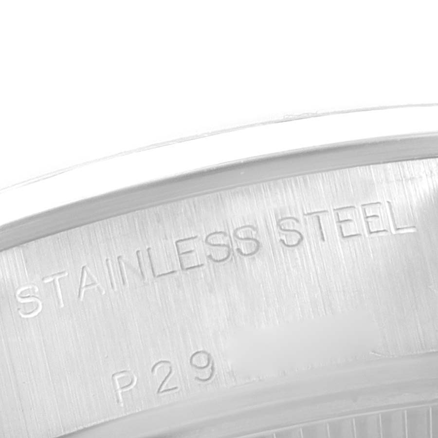 This image shows a close-up of the case back of a Rolex Date 79160 Women
s Stainless Steel Blue Dial 79160 Women
s Stainless Steel Blue Dial, highlighting the "Stainless Steel" engraving.