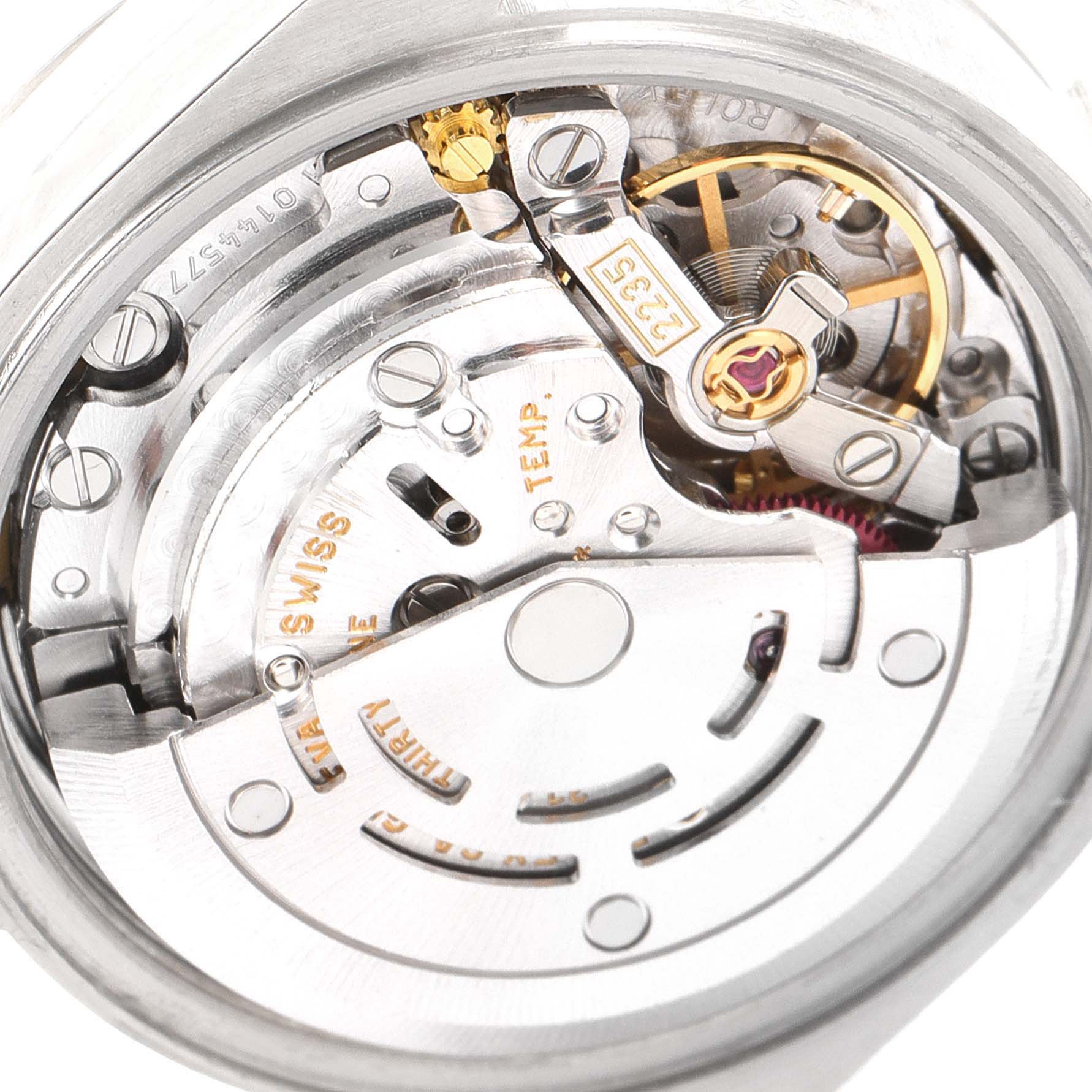 The image shows a close-up view of the movement parts of a Rolex Date 79160 Women
s Stainless Steel Blue Dial 79160 Women
s Stainless Steel Blue Dial model watch, highlighting intricate mechanical components.