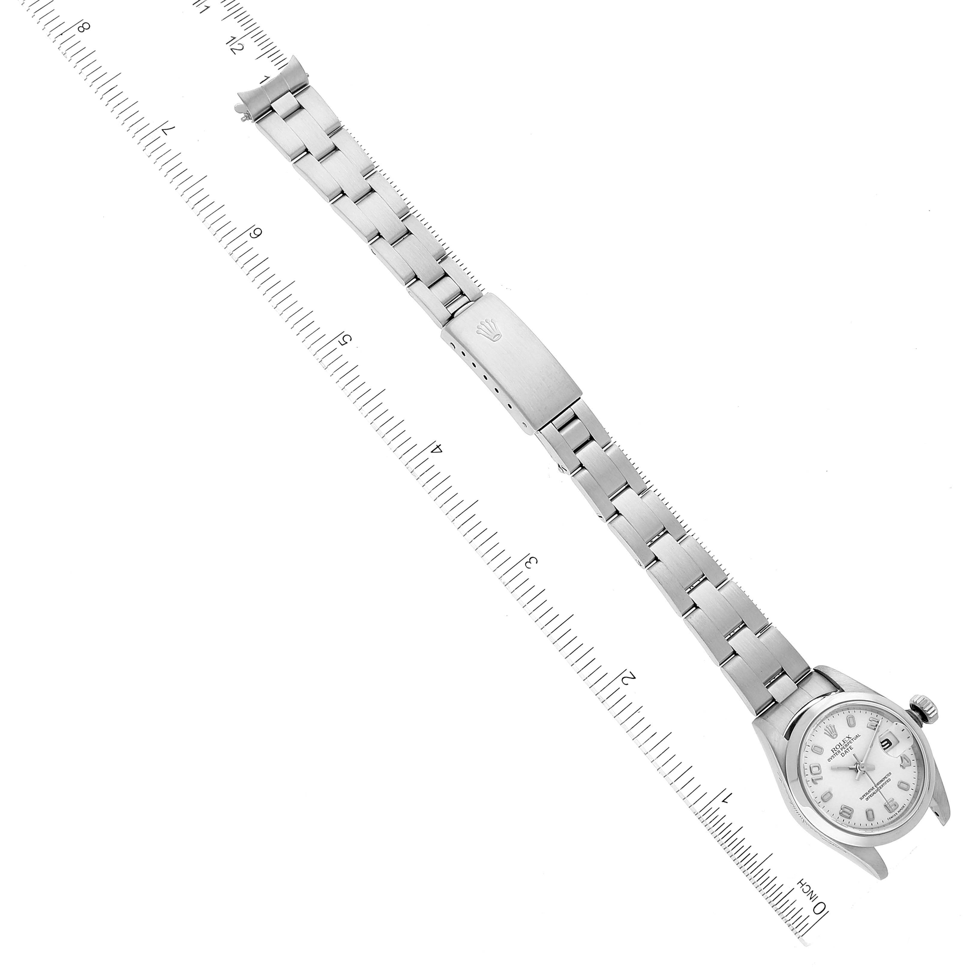 This image shows a top-down view of a Rolex Date 79160 Women's Stainless Steel White Dial 79160 Women's Stainless Steel White Dial model watch, including the full bracelet, clasp, and dial.