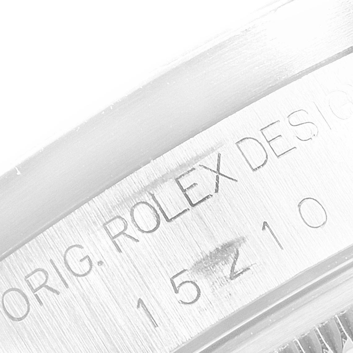 This image shows a close-up of the side engraving on the casing of a Rolex Date 15210 Men's Stainless Steel Silver Dial 15210 Men's Stainless Steel Silver Dial model watch.