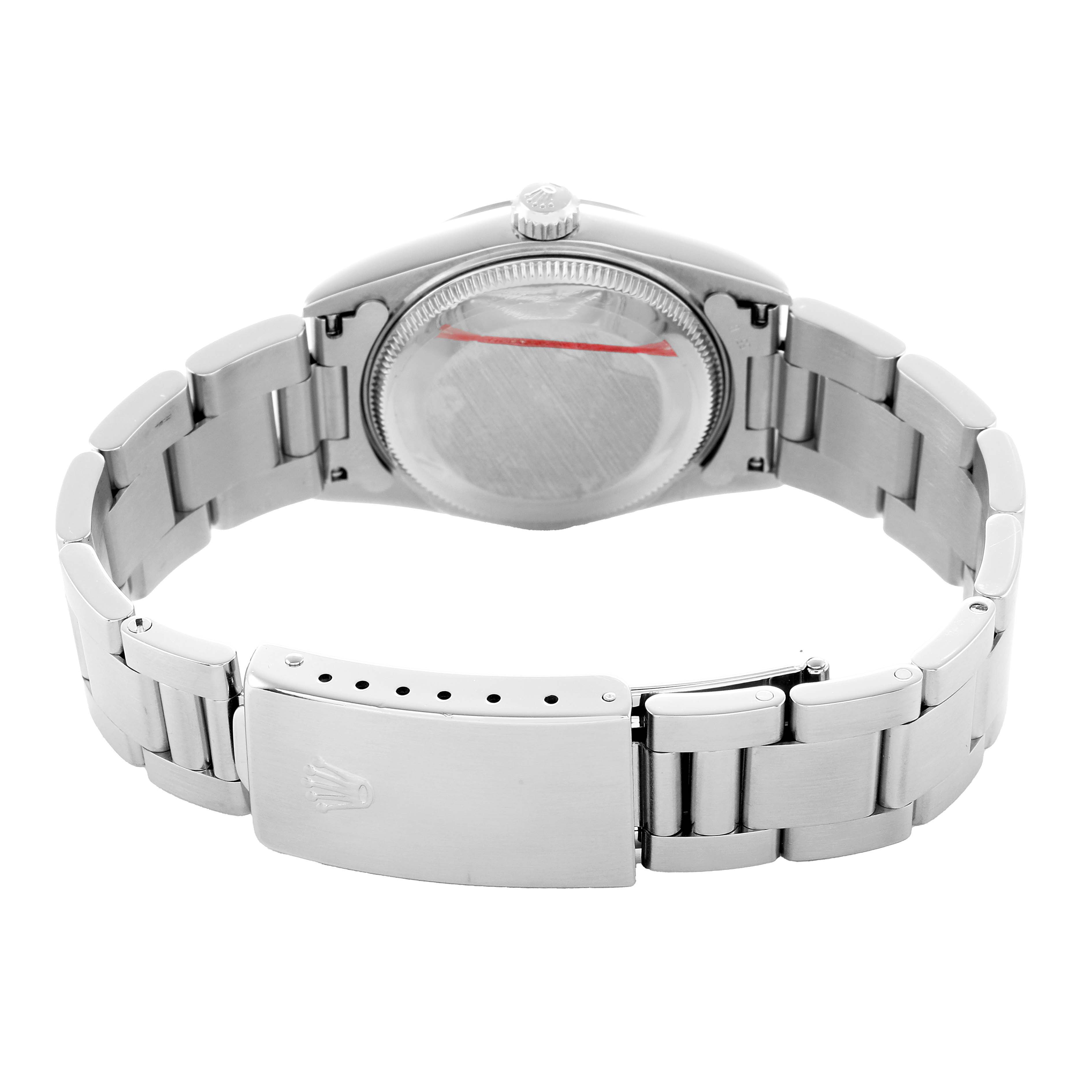 The image shows a Rolex Mid-Size 68240 Women's Stainless Steel Pink Dial watch from the back, highlighting the case back, bracelet, and clasp.