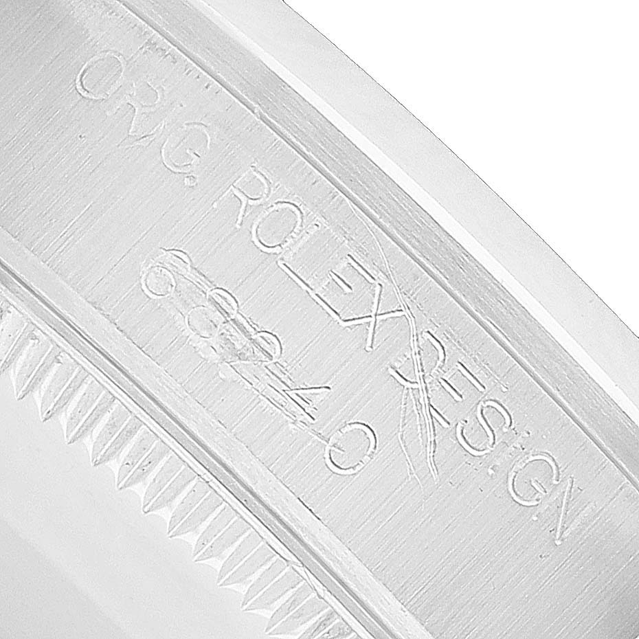 The image shows the case back engraving of a Rolex Mid-Size 68240 Women's Stainless Steel Pink Dial model with the serial number and "ORIG. ROLEX DESIGN."