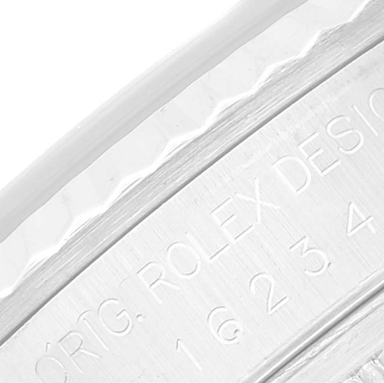 This close-up image shows the engraved inner bezel of the Rolex Datejust 16234 Men's Stainless Steel Pink Dial 16234 Men's Stainless Steel Pink Dial watch.
