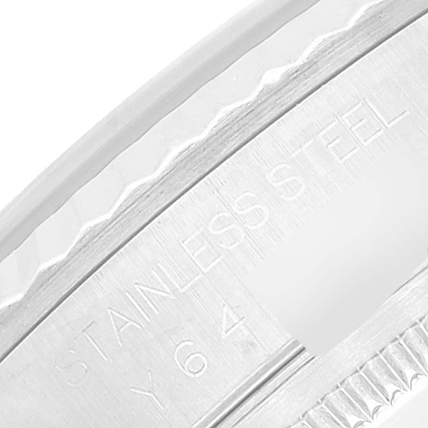 This image shows a close-up of the side engraving on the bezel of a Rolex Datejust 16234 Men's Stainless Steel Pink Dial 16234 Men's Stainless Steel Pink Dial watch.