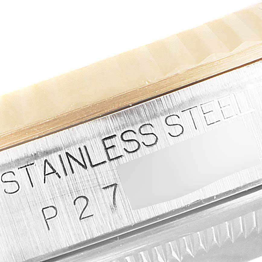 This close-up image shows the side engraving on a stainless steel Rolex Datejust 16233 Men's Steel and Gold (two tone) Champagne Dial 16233 Men's Steel and Gold (two tone) Champagne Dial watch case.