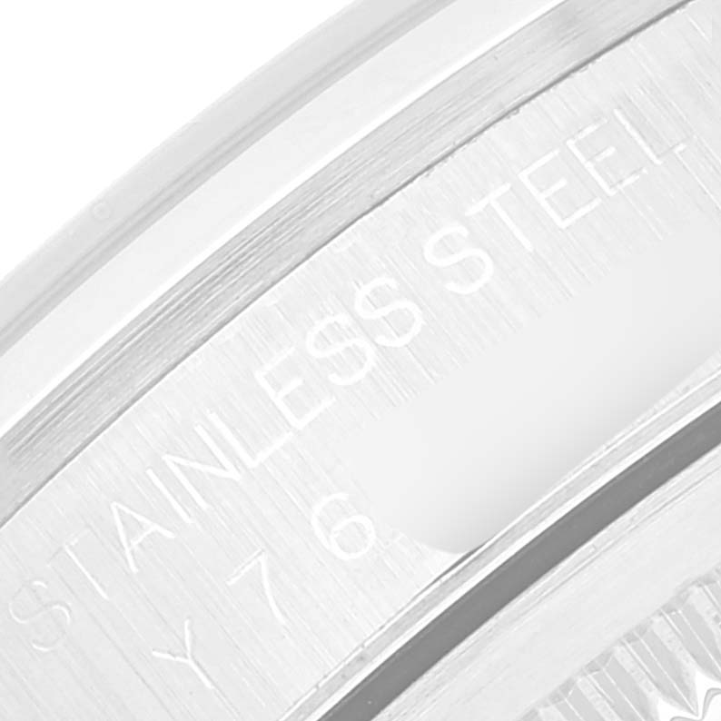 The image shows a close-up of the stainless steel case back edge of a Rolex Datejust 16200 Men's Stainless Steel Black Dial 16200 Men's Stainless Steel Black Dial watch.