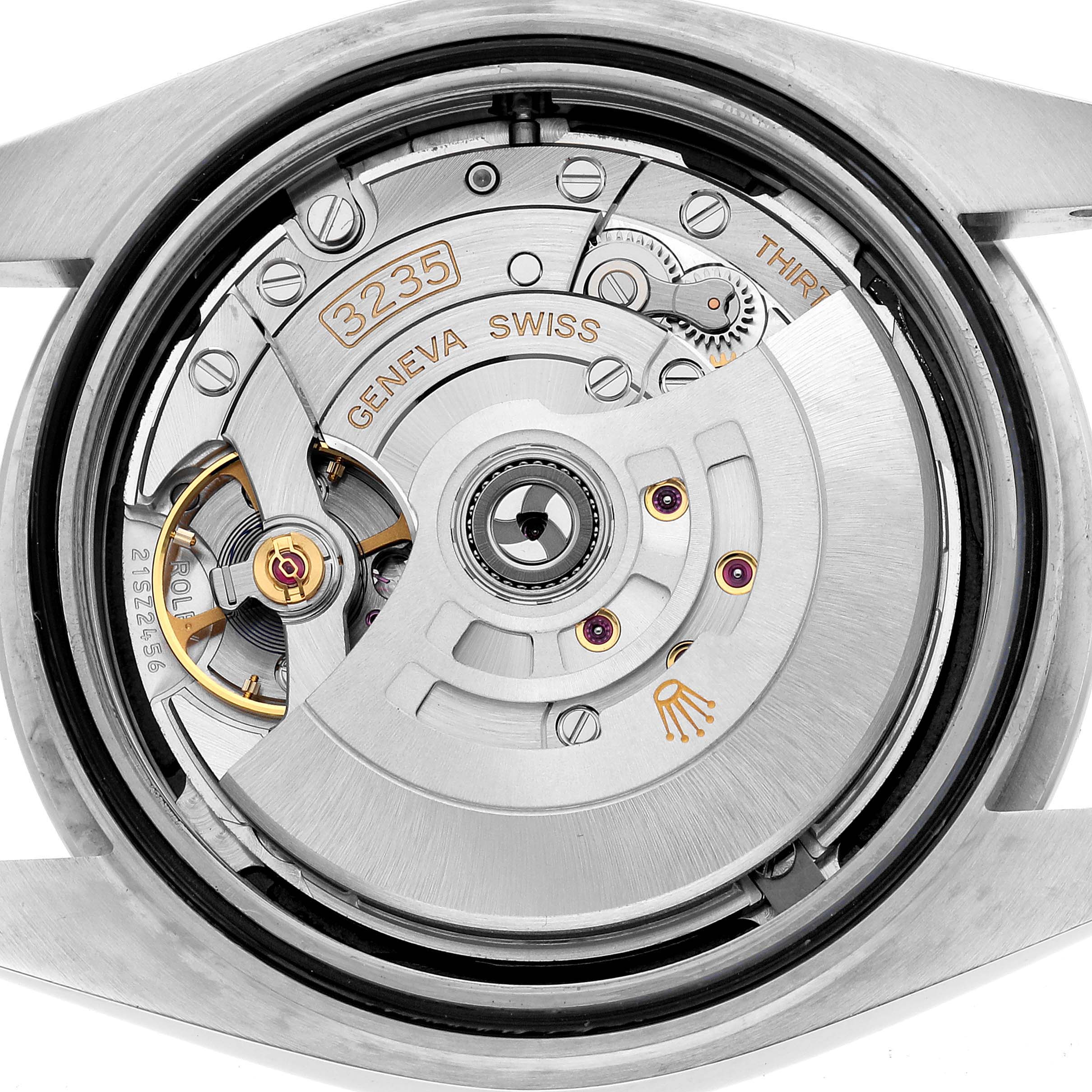 The image shows the Rolex Datejust 41 126300 Men's Stainless Steel Black Dial movement from the back, highlighting the intricate mechanical components.