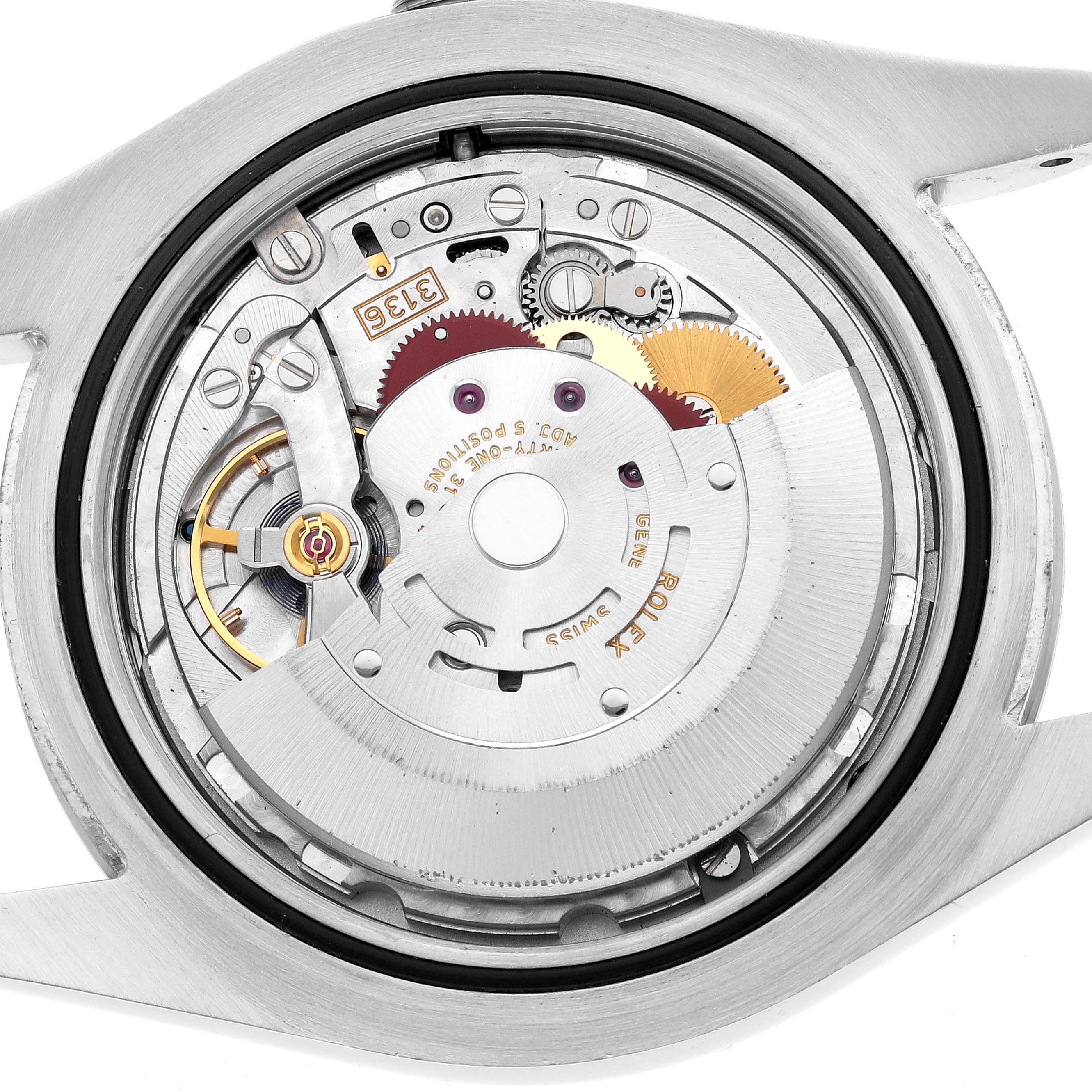 The image shows the internal movement of the Rolex Datejust 41 116334 Men's Stainless Steel Blue Dial, highlighting gears and components from a top view.