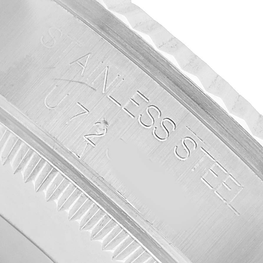 The image shows a close-up angle of the bezel and case side, displaying "STAINLESS STEEL" on the Rolex Mid-Size 68274 Women's Stainless Steel Blue Dial watch.