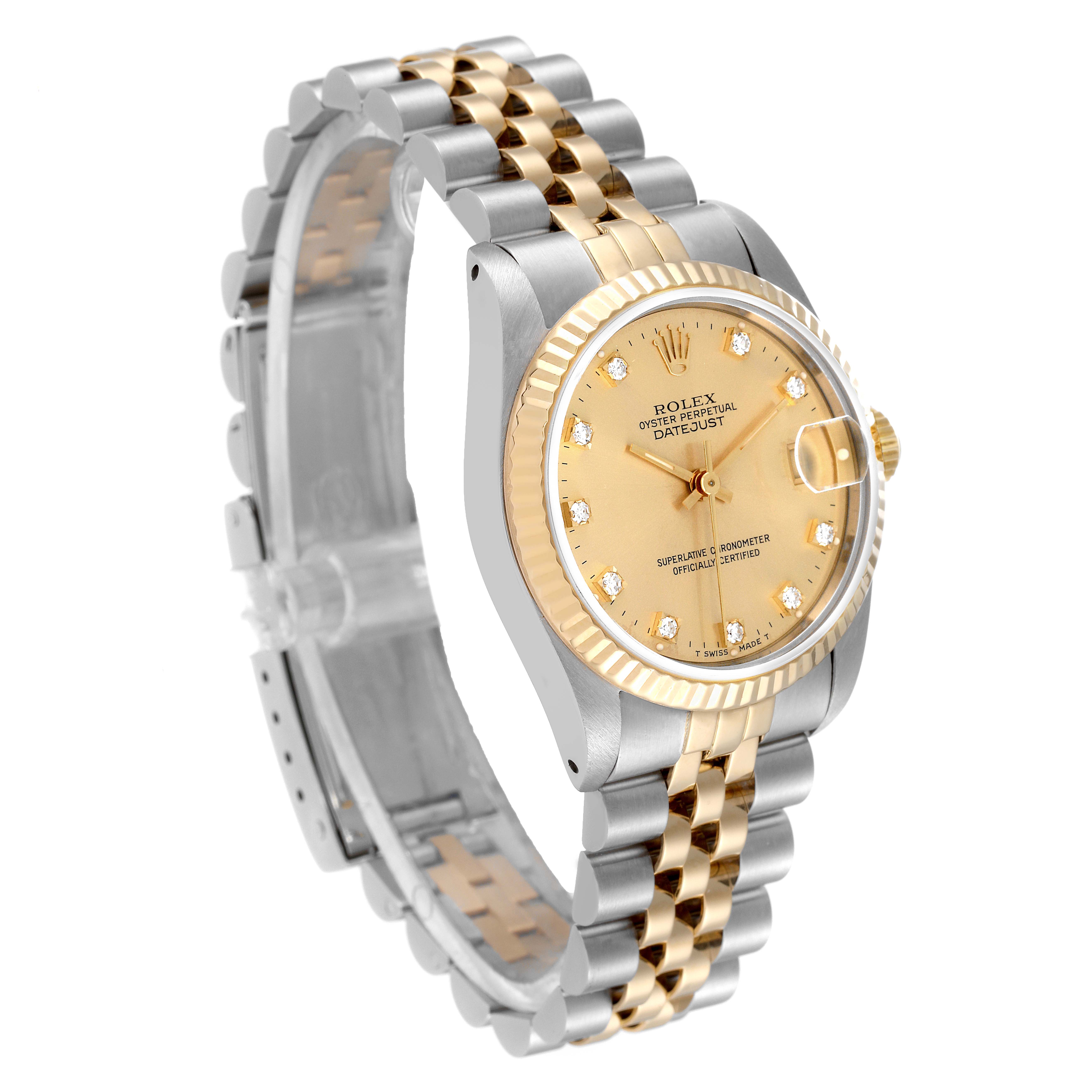 This image depicts a Rolex Mid-Size 68273 Women
s Steel and Gold (two tone) Champagne Dial 68273 Women
s Steel and Gold (two tone) Champagne Dial Datejust watch from an angled side view, showcasing its dial, bezel, and two-tone bracelet.