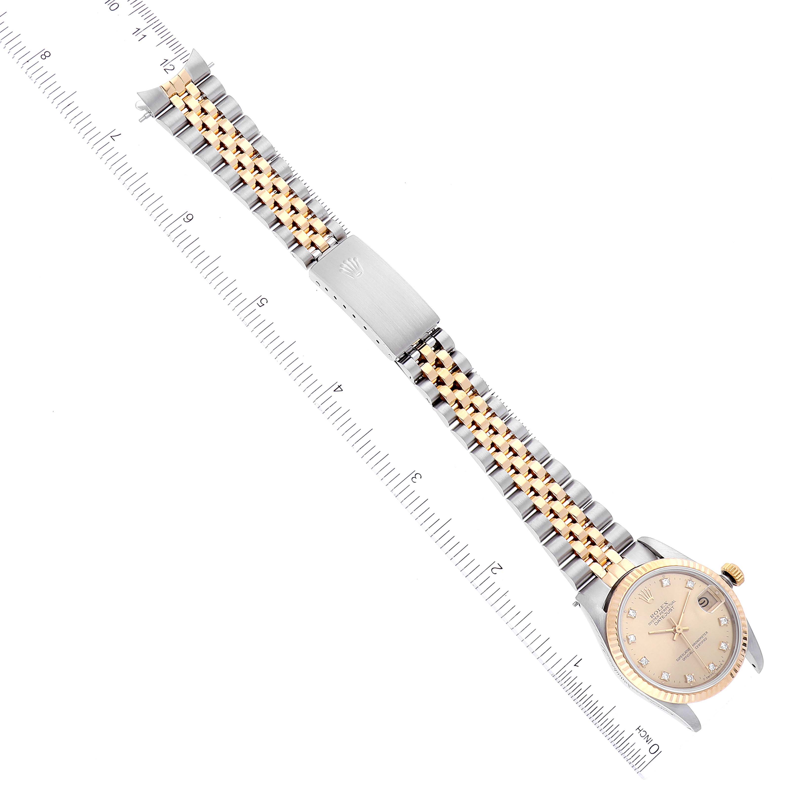 This image shows a top-down view of a Rolex Mid-Size 68273 Women
s Steel and Gold (two tone) Champagne Dial 68273 Women
s Steel and Gold (two tone) Champagne Dial model watch, featuring the dial, bracelet, and clasp.