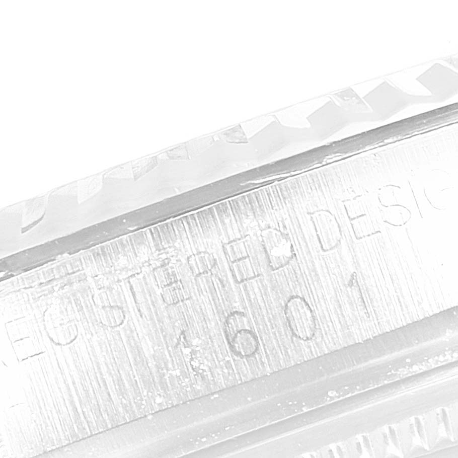 The angle shows a close-up of the side of the bezel and case with the inscription "REGISTERED DESIGN 1601" of the Rolex Vintage Collection 1601 Men's Stainless Steel Silver Dial 1601 Men's Stainless Steel Silver Dial watch.