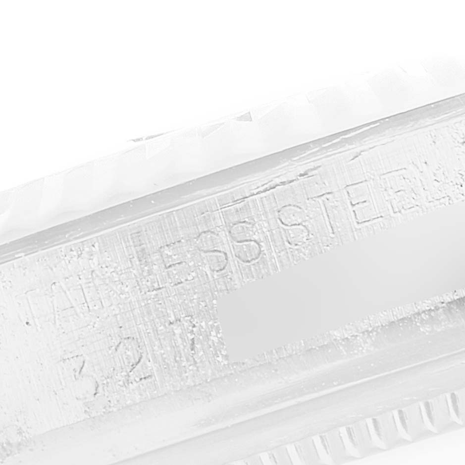 This close-up image shows the side engraving of the Rolex Vintage Collection 1601 Men's Stainless Steel Silver Dial 1601 Men's Stainless Steel Silver Dial watch model, highlighting the "Stainless Steel" inscription.