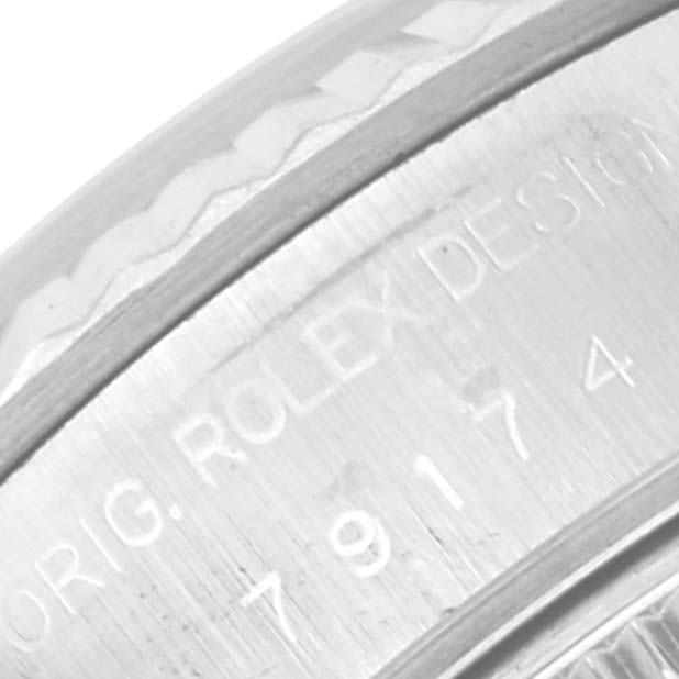 This close-up shows the engraved inner bezel of a Rolex Datejust 79174 Women's Stainless Steel Mother of Pearl Dial 79174 Women's Stainless Steel Mother of Pearl Dial watch.