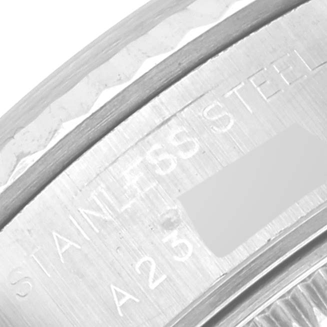 This close-up image shows the stainless steel engraving on the side of a Rolex Datejust 79174 Women's Stainless Steel Mother of Pearl Dial 79174 Women's Stainless Steel Mother of Pearl Dial watch case.