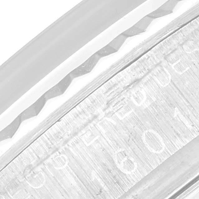 This image shows a close-up of the engraved serial number on a Rolex Vintage Collection 1601 Men's Stainless Steel Silver Dial 1601 Men's Stainless Steel Silver Dial watch's case.