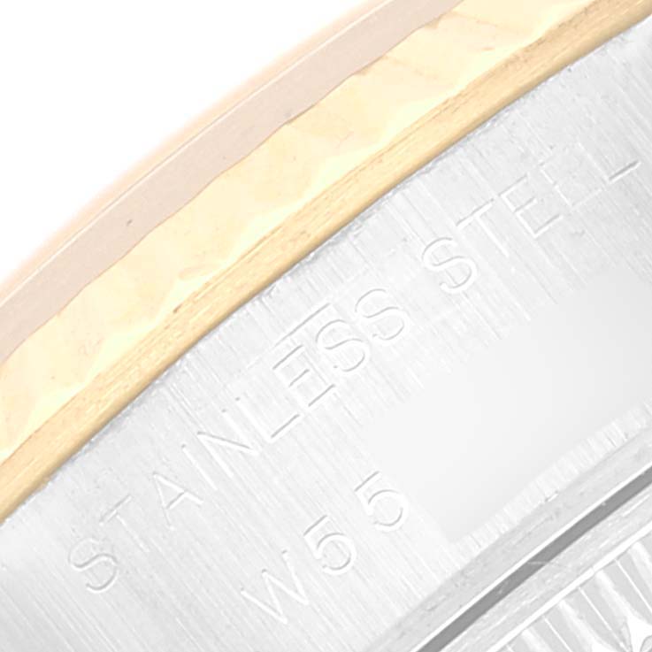 This image shows a close-up of the Rolex Datejust 69173 Women's Steel and Gold (two tone) Champagne Dial 69173 Women's Steel and Gold (two tone) Champagne Dial's case edge with "STAINLESS STEEL" engraving.