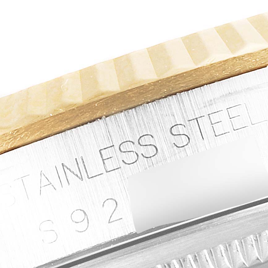 The image shows a close-up of the stainless steel case and fluted bezel of a Rolex Datejust 16233 Men's Steel and Gold (two tone) Champagne Dial 16233 Men's Steel and Gold (two tone) Champagne Dial watch.