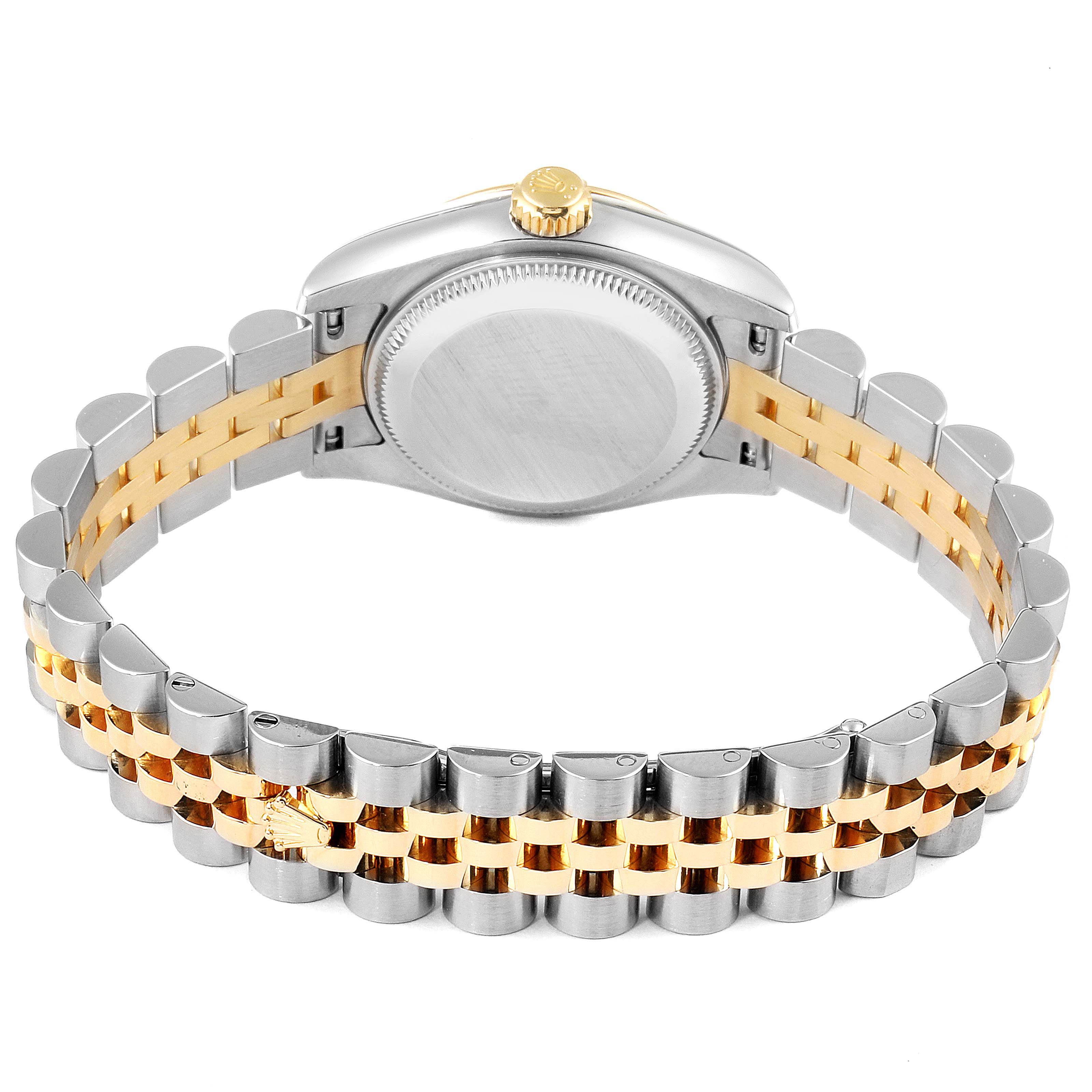 The image shows the back view of a Rolex Datejust 179173 Women
s Steel and Gold (two tone) Champagne Dial 179173 Women
s Steel and Gold (two tone) Champagne Dial watch, highlighting its case back and two-tone jubilee bracelet.