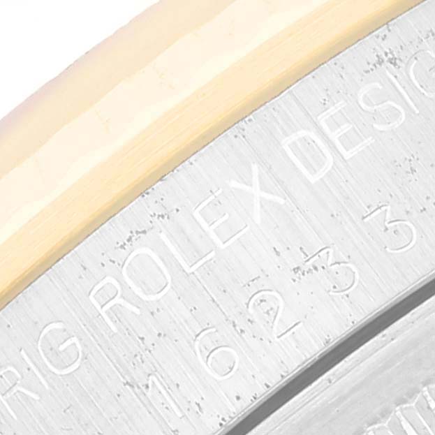 This close-up image shows the side engraving of a Rolex Datejust 16233 Men's Steel and Gold (two tone) White Dial 16233 Men's Steel and Gold (two tone) White Dial watch, highlighting the model and branding.