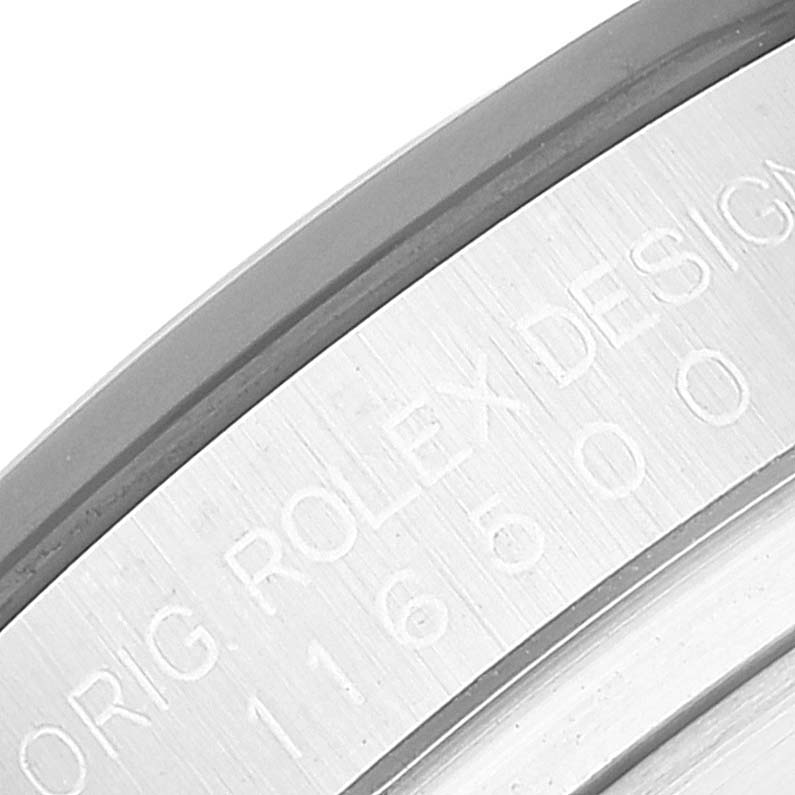 Close-up of the edge of the dial, showing model number 116500 engraved with "ORIG ROLEX DESIGN" on the Rolex Daytona 116500 Men's Stainless Steel White Dial 116500 Men's Stainless Steel White Dial watch.