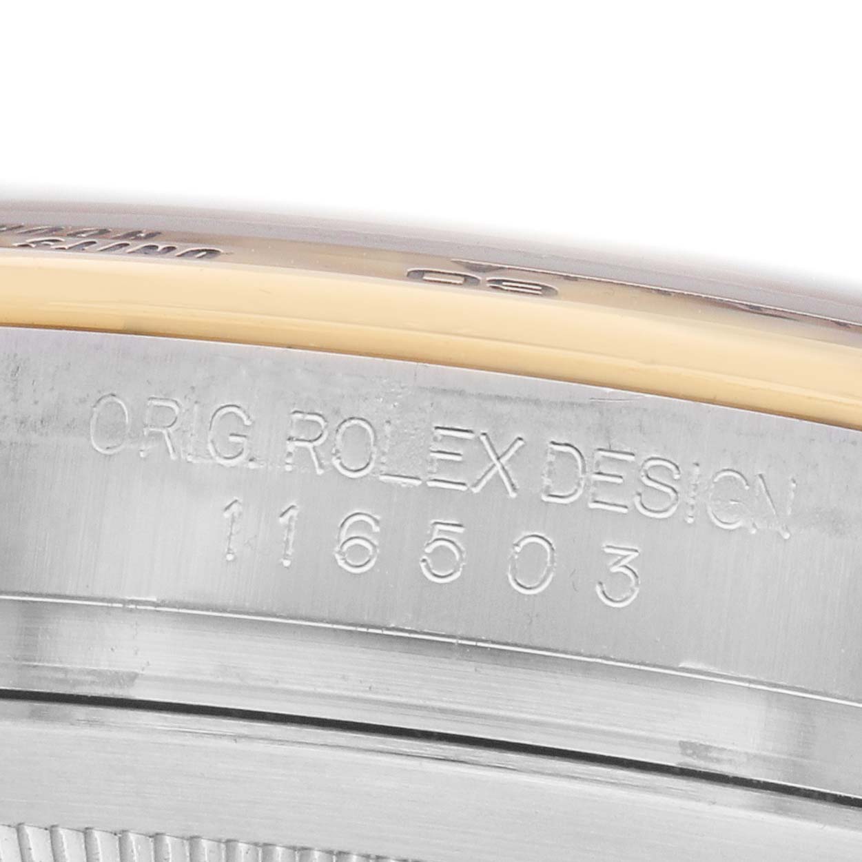 The image shows a close-up of the engraved case side and bezel edge of a Rolex Daytona 116503 Men's Steel and Gold (two tone) Black Dial watch.