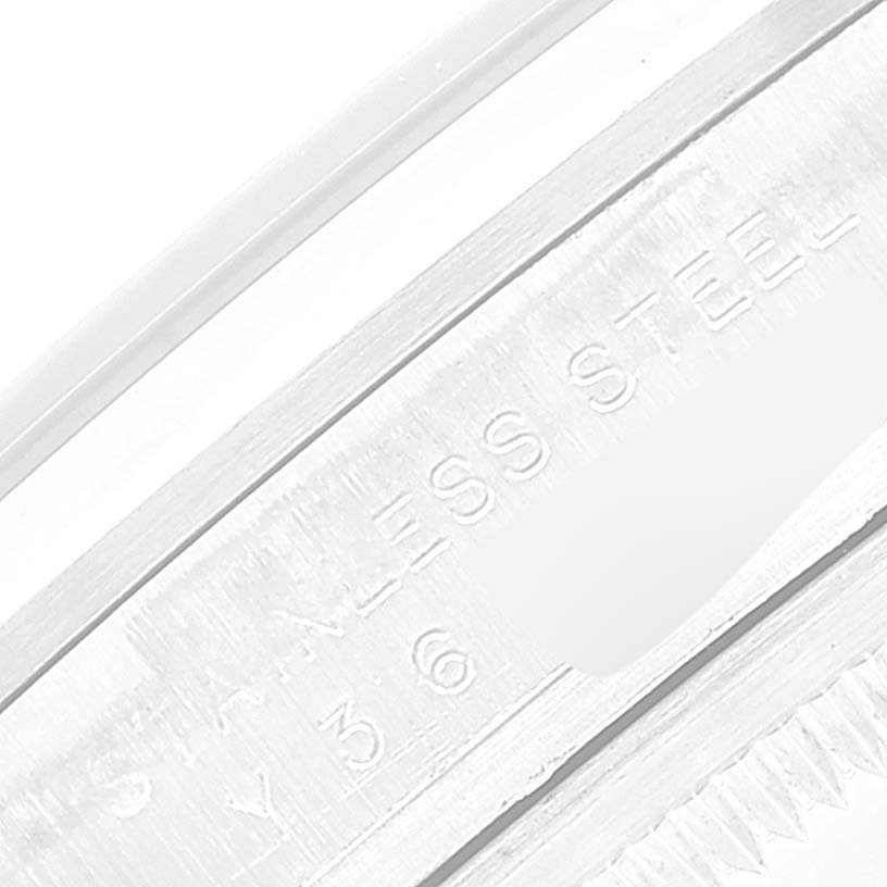 The image shows a close-up of the engraved lettering on a stainless steel Rolex Explorer 114270 Men
s Stainless Steel Black Dial 114270 Men
s Stainless Steel Black Dial watch case.