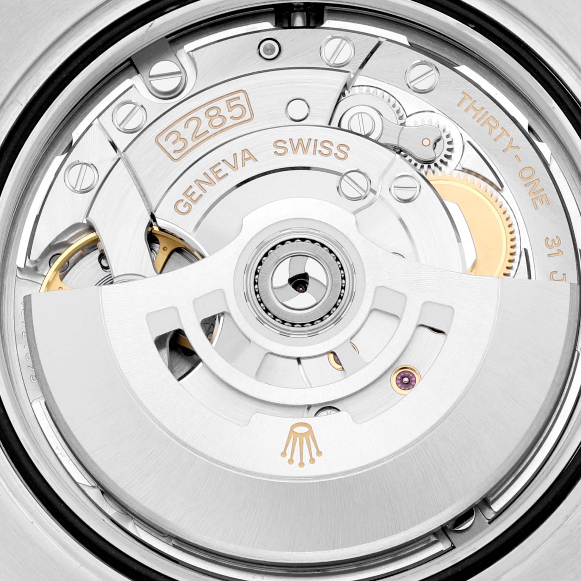 The image shows the intricate internal mechanism, including the 3285 movement, of the Rolex GMT-Master 126710 Men's Stainless Steel Black Dial 126710 Men's Stainless Steel Black Dial watch.