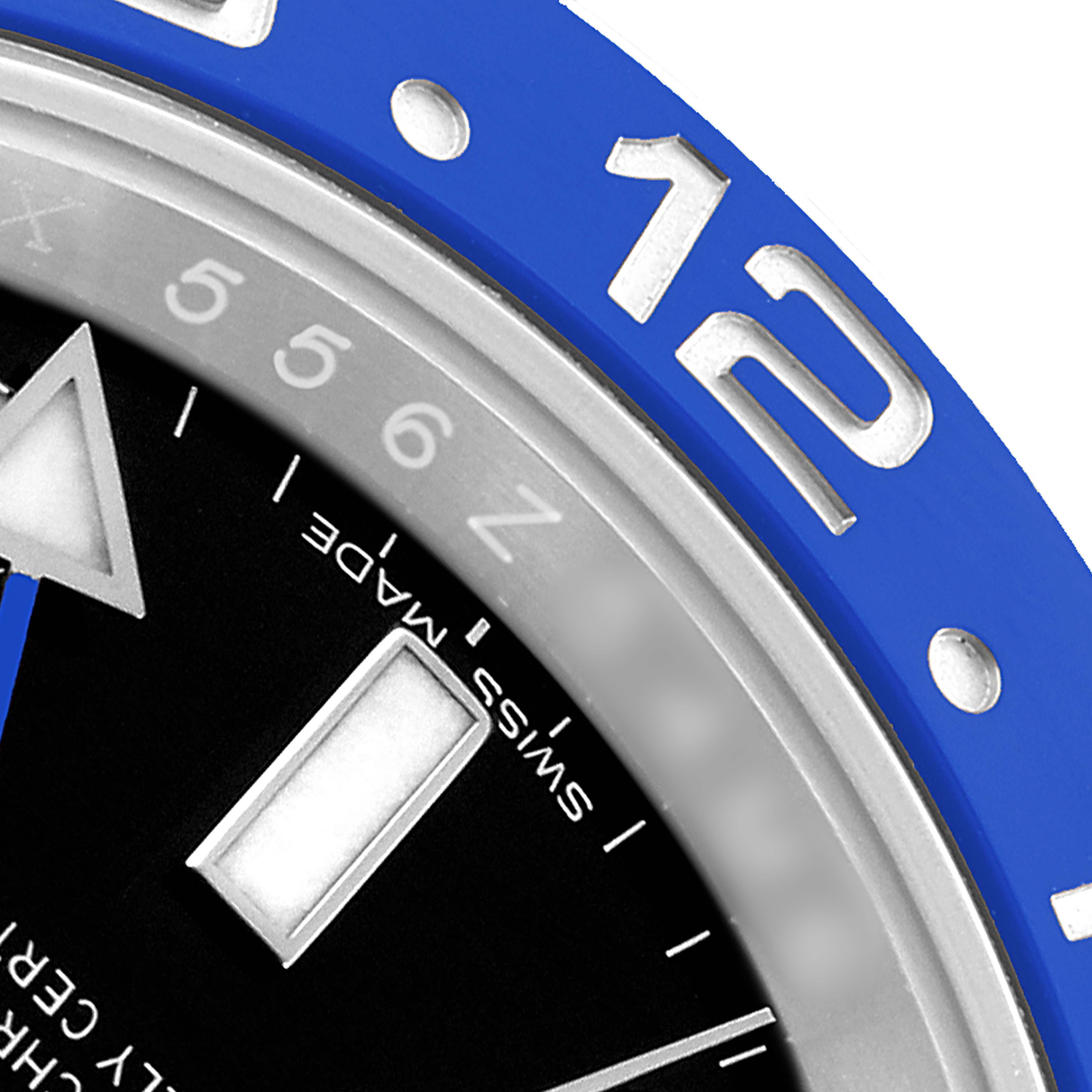 The image shows a close-up of the Rolex GMT-Master 116710BLNR Men's Stainless Steel Black Dial's bezel, dial, and part of the hour markers.