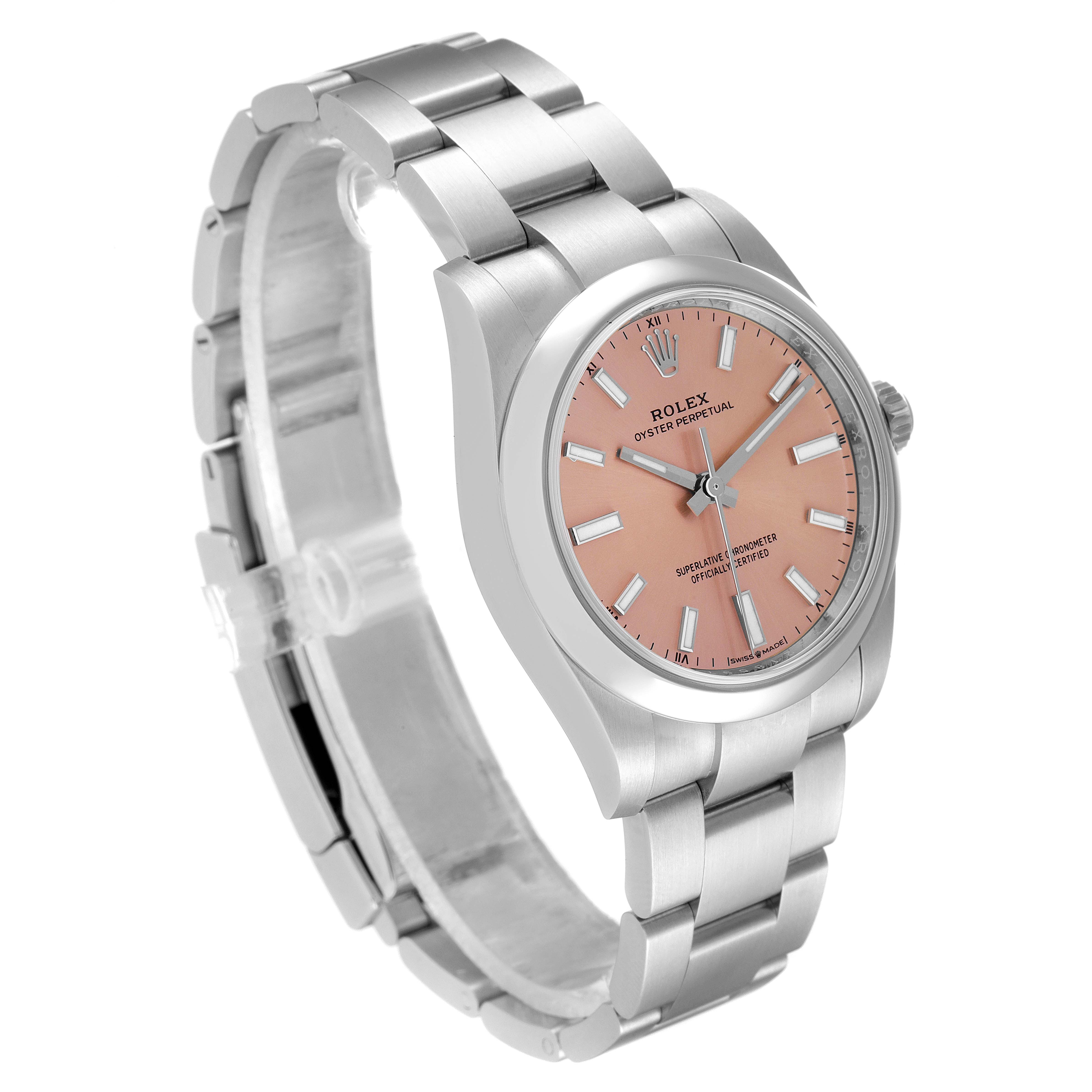 The image shows the Rolex Oyster Perpetual 124200 Men
s Stainless Steel Pink Dial 124200 Men
s Stainless Steel Pink Dial watch at a three-quarter angle, highlighting its pink dial and metal bracelet.