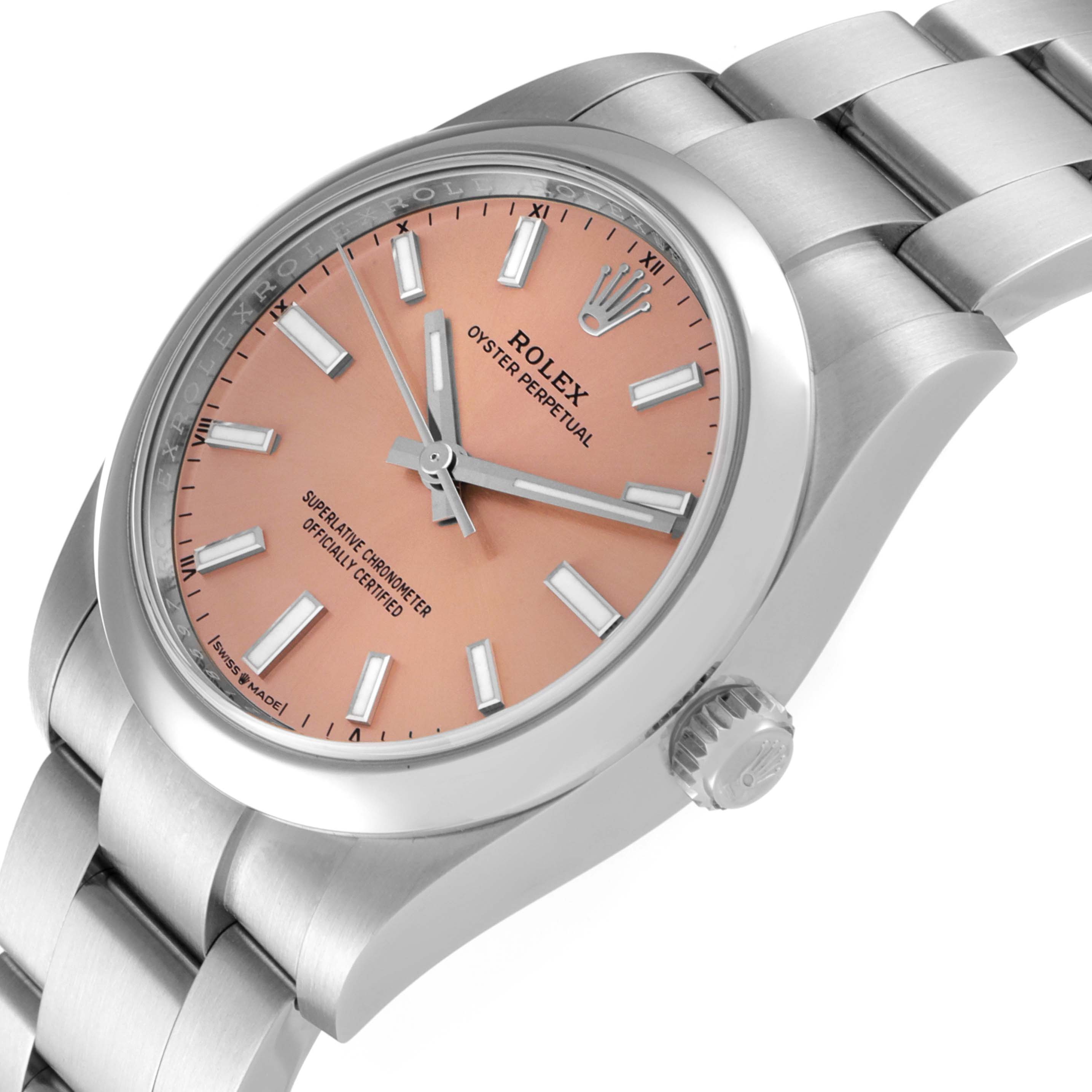 This image shows a side angle of a Rolex Oyster Perpetual 124200 Men
s Stainless Steel Pink Dial 124200 Men
s Stainless Steel Pink Dial watch, highlighting the dial, bezel, crown, and part of the bracelet.