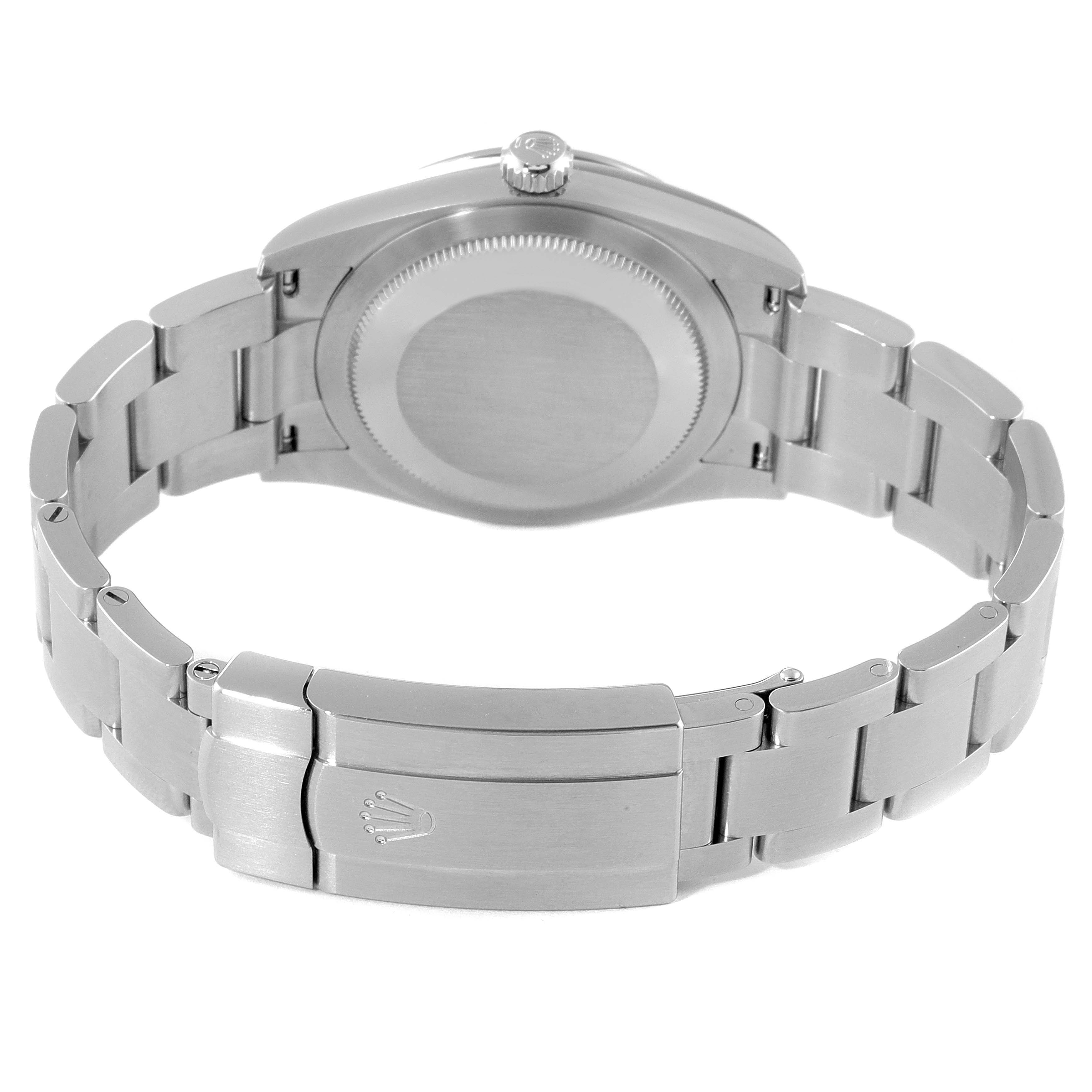 The image shows the back view of a Rolex Oyster Perpetual 124200 Men
s Stainless Steel Pink Dial 124200 Men
s Stainless Steel Pink Dial watch, displaying the case back and the bracelet with its clasp.