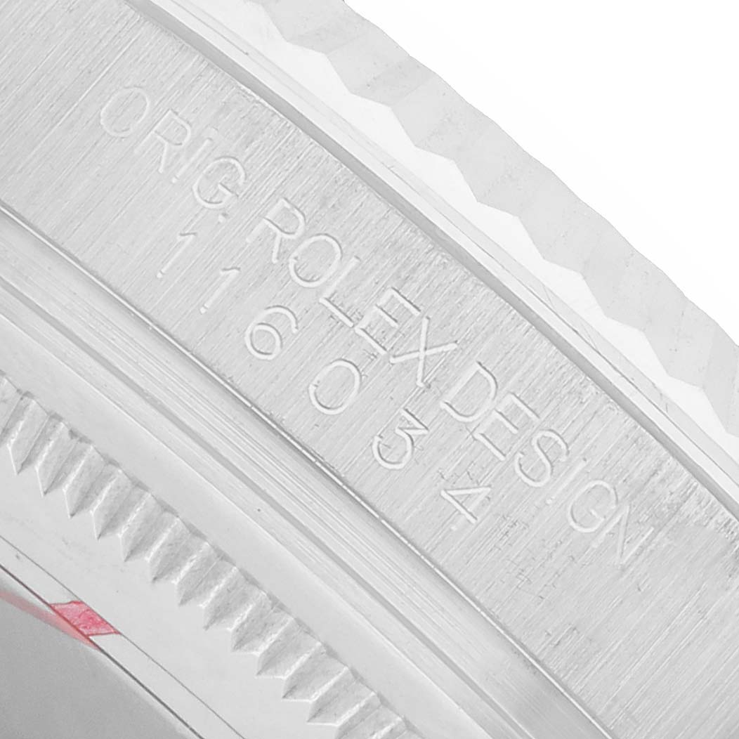The image shows a close-up of the etched side of an Oyster Perpetual by Rolex, displaying the model details.