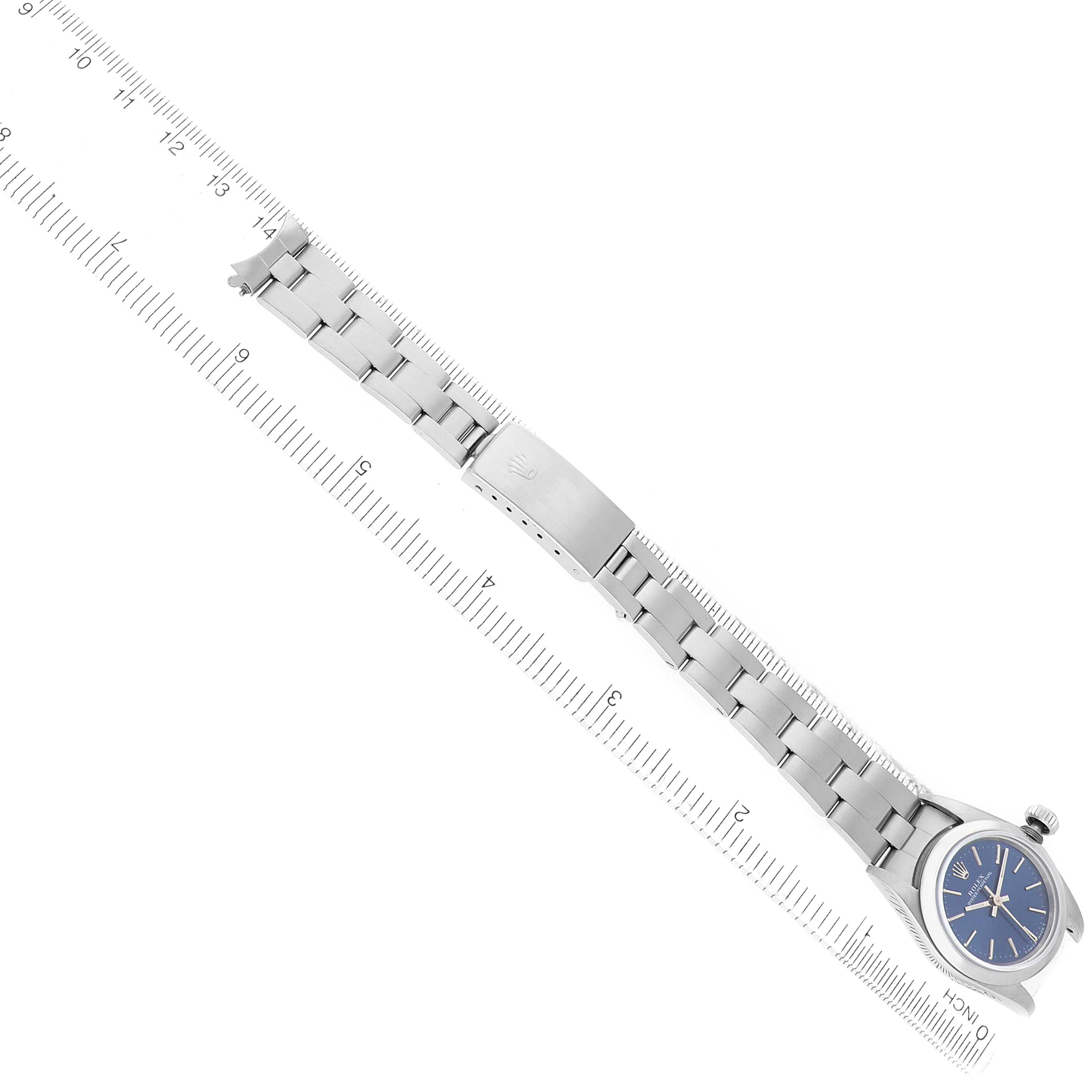 The Rolex Oyster Perpetual 67180 Women's Stainless Steel Blue Dial watch is displayed from a top view, showing the bracelet, clasp, and part of the face.