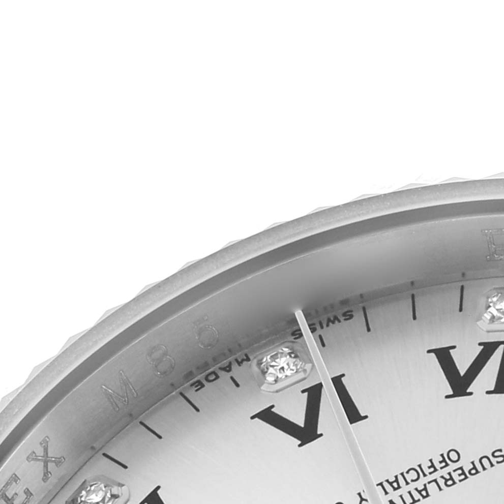 The image shows a close-up of the dial on a Rolex Oyster Perpetual 116034 Men's Stainless Steel Silver Dial, focusing on the hour markers and bezel edge.