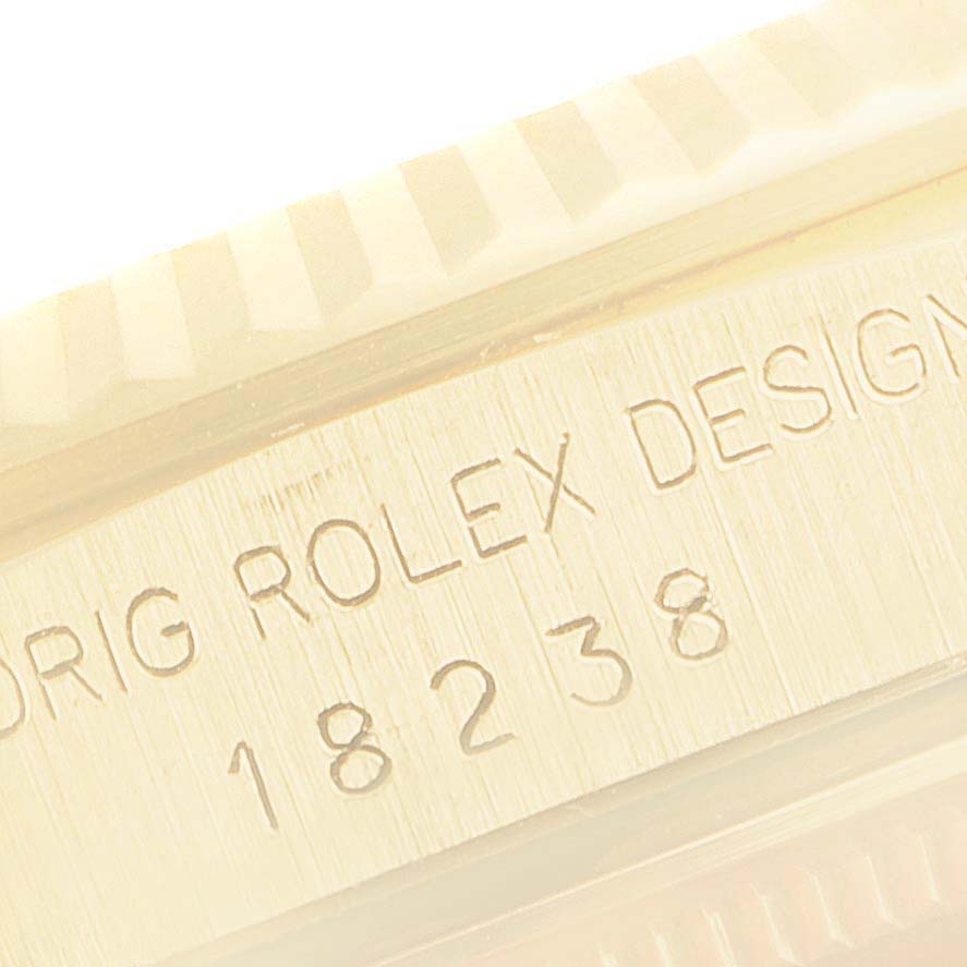 The image shows a close-up of the side engraving of a Rolex President 18238 Men's Yellow Gold Champagne Dial 18238 Men's Yellow Gold Champagne Dial model 18238.
