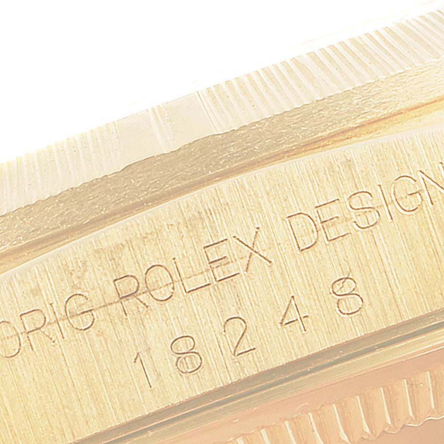 The image shows an angled close-up of the case and inner bezel with engravings on the Rolex President 18248 Men
s Yellow Gold Champagne Dial 18248 Men
s Yellow Gold Champagne Dial watch.