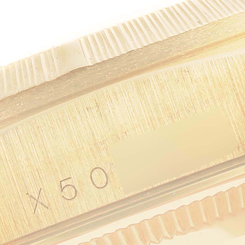 This close-up image shows the engraved serial number on the side of a Rolex President 18248 Men
s Yellow Gold Champagne Dial 18248 Men
s Yellow Gold Champagne Dial model watch.