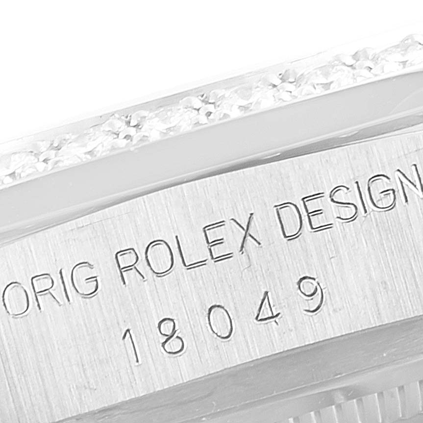 This close-up image shows the model number and part of the bezel of a Rolex President 18049 Men
s White Gold Silver Dial 18049 Men
s White Gold Silver Dial watch.
