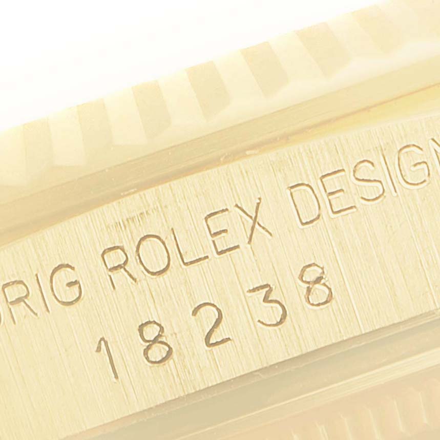 This close-up image shows the engraved side of the Rolex President 18238 Men's Yellow Gold Beige Dial 18238 Men's Yellow Gold Beige Dial model 18238, highlighting the model number and design engraving.
