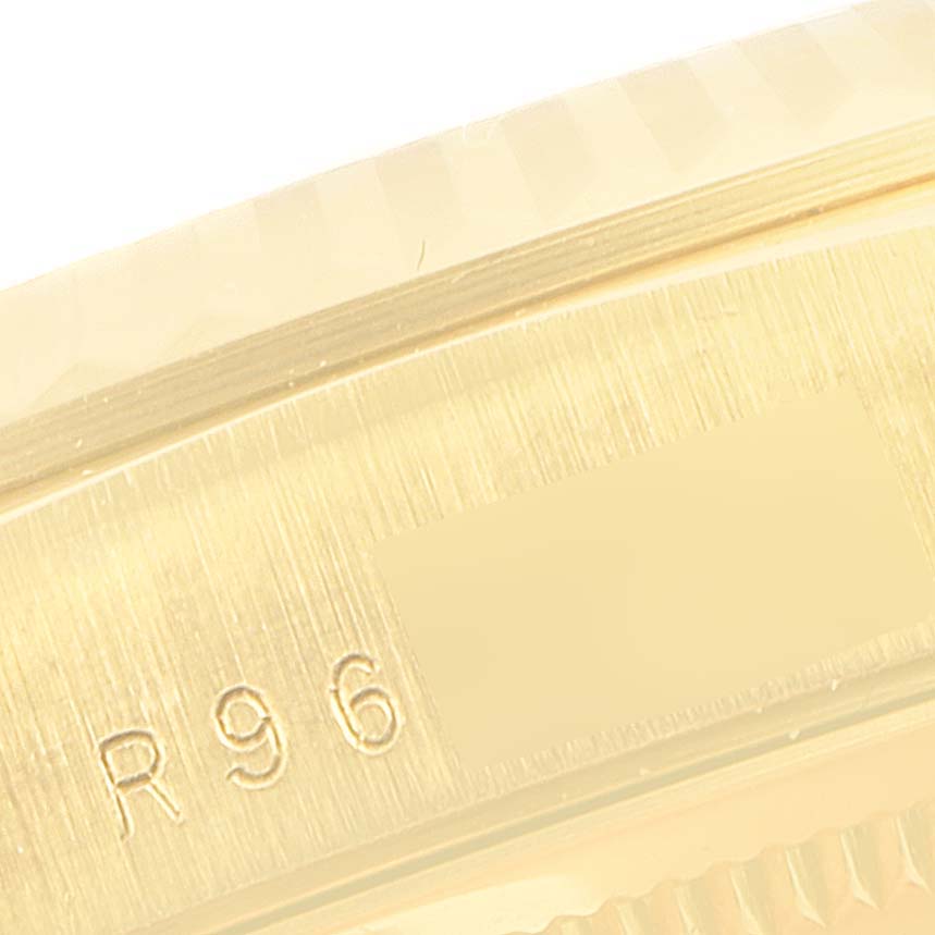 This image shows a close-up of the engraved serial number on the case of a Rolex President 18238 Men's Yellow Gold Champagne Dial 18238 Men's Yellow Gold Champagne Dial model watch.