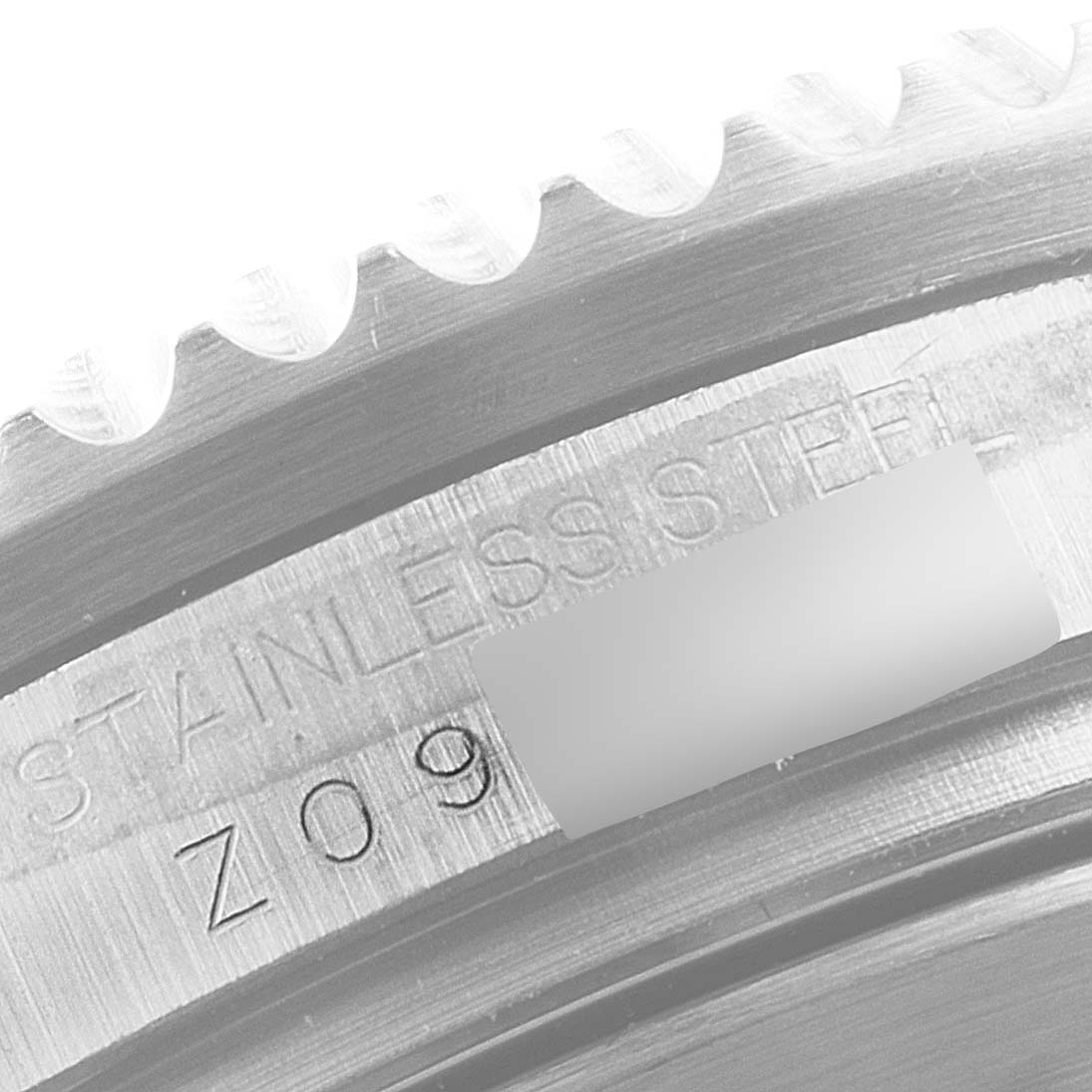 This close-up image shows the stainless steel engraving of the bezel edge on a Rolex Sea-Dweller 16600 Men
s Stainless Steel Black Dial 16600 Men
s Stainless Steel Black Dial watch.