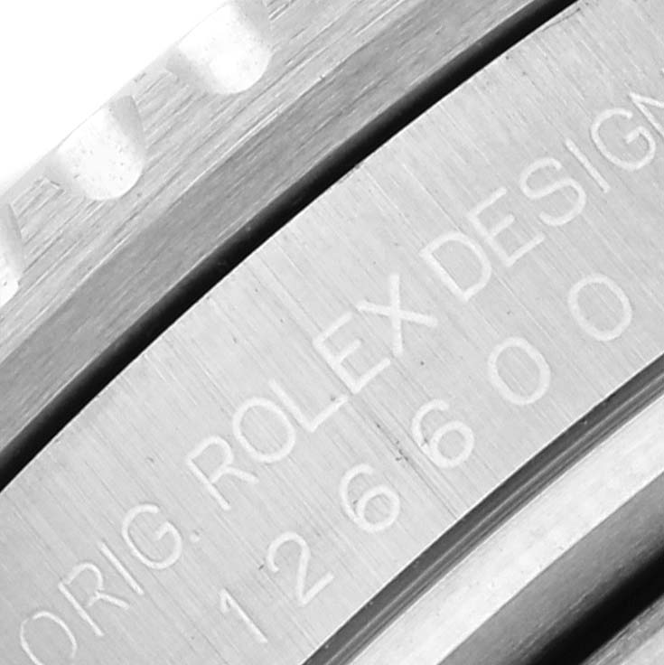 A close-up of the Rolex Sea-Dweller 126600 Men
s Stainless Steel Black Dial 126600 Men
s Stainless Steel Black Dial
s side, showing model number "126600" and "ROLEX DESIGN" engraving.