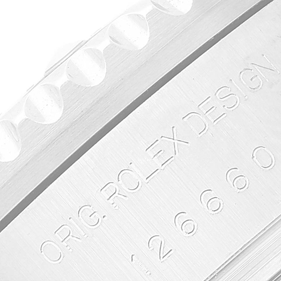 This close-up shows the engraved text on the case of the Rolex Sea-Dweller 126660 Men's Stainless Steel Black Dial 126660 Men's Stainless Steel Black Dial watch.