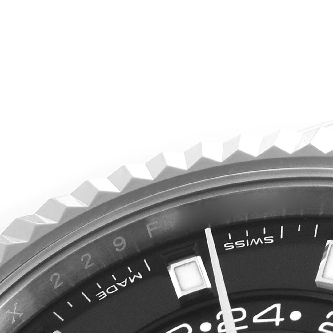 The image shows a close-up angled view of the bezel and part of the dial of the Rolex Sky-Dweller 326934 Men's Stainless Steel Black Dial.