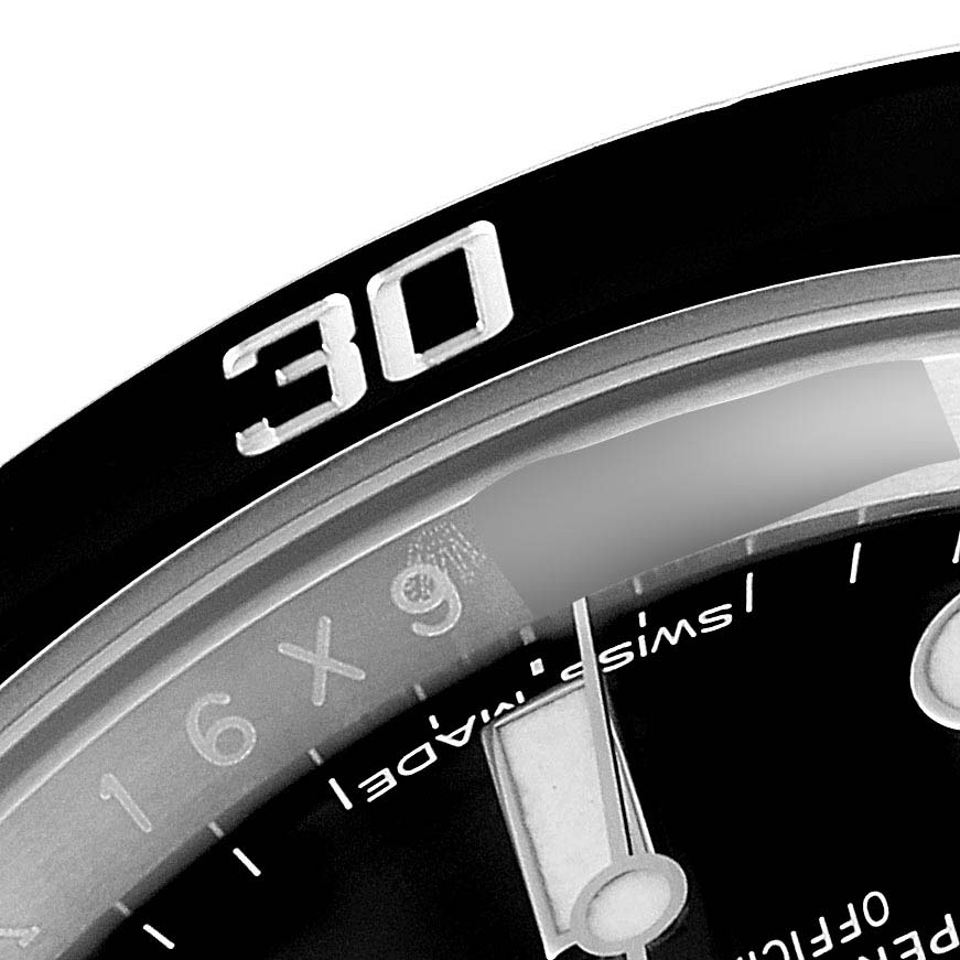 The image shows a close-up of the bezel and part of the dial of a Rolex Submariner 114060 Men
s Stainless Steel Black Dial 114060 Men
s Stainless Steel Black Dial watch, focusing on the 30-minute marker.